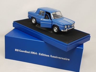 an image of a blue model of a car on a black platform