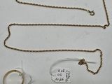 three pieces of jewelry are displayed on a white surface