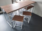 four stools sitting at a table in a kitchen