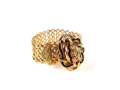 une image représentant une bague en or ornée d'un nœud