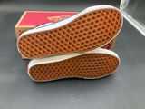 vans off the wall slip - ons in red and white with a box