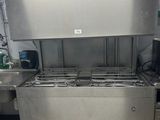 a machine that is sitting in a kitchen with a lot of counter space