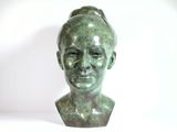 sculpture of a woman ' s head with a bun on her head