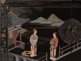 a black and gold decorated cabinet with asian figures on it