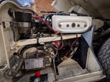 a close up of the engine of a car with its hood open