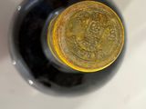 a bottle of wine that is sitting on a table