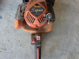a chainsaw that is sitting on the concrete floor