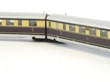 a toy train that is sitting on a white surface
