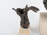 two sculptures that are sitting on top of each other