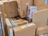 many boxes stacked on top of each other in a warehouse