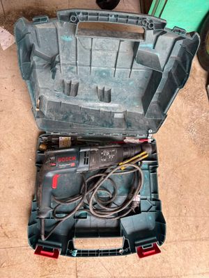 a tool box with tools inside of it on the floor