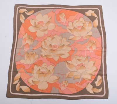 an image of a square scarf with flowers and leaves on it