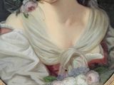 portrait of a woman in a white dress with a bouquet of flowers in her hair