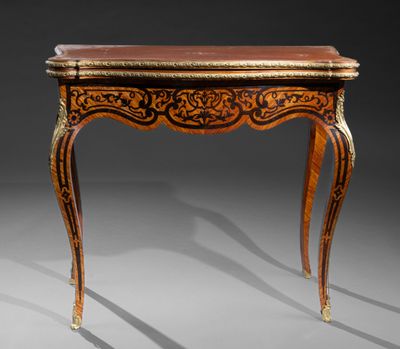 a small table with a wooden top and ornate carvings