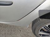 a close up of a car ' s door handle and tire