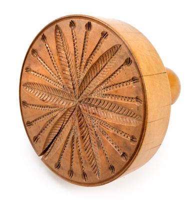 an image of a wooden ring with a decorative design on it
