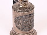 a silver and gold cup that is on top of a table