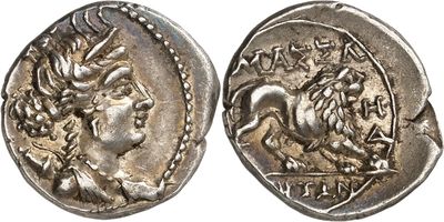 a silver coin with an image of a horse on it
