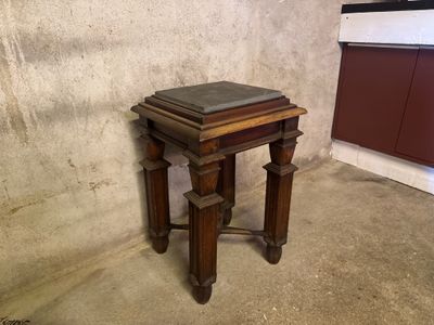 a small table with a book on top of it