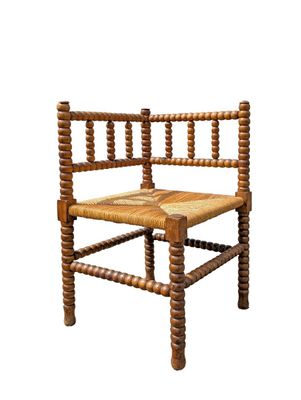 a wooden chair with a woven seat on a white background