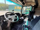 a view of the inside of a bus from the driver ' s seat