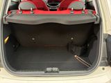 the back of a car with its trunk open and the seats folded down