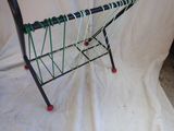 a metal rack with a green and black design on it