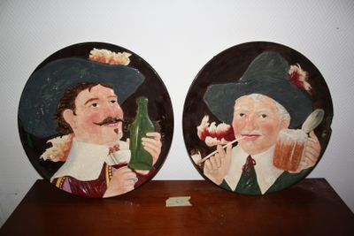 two plates with a picture of a man and a woman on them