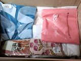 a box that has a lot of clothes in it