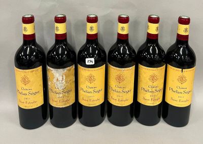 six bouteilles de vin rouge alignées sur une table