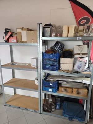 a shelf with many items on it in a room