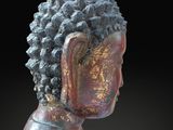 a close up of a statue of a person with a black background