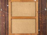a close up of a picture frame hanging on a wall