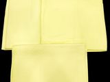 four yellow napkins on a black background with a black background