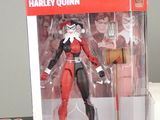 toy figure of harley quinn from dc collectibles in a box