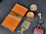 a purse, keychain, and other items that are on a table
