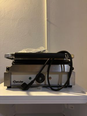 a laptop on a table with a pair of glasses on it