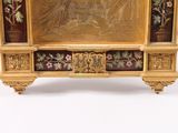 a gold frame with a picture of a woman on it