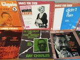 a lot of records that are on a table