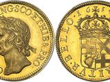 une pièce souveraine en or surmontée d'une couronne