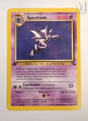 a close up of a pokemon card on a white surface