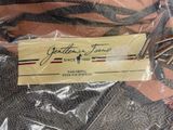 a label on a piece of clothing that is wrapped in plastic