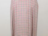 a woman ' s skirt with a red, white and blue checkered pattern