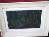 a picture of a painting of a forest scene in a white frame