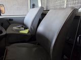 an image of a van with two seats and a steering wheel