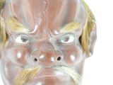 a close up of a statue of a man with a mustache