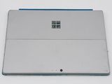 a laptop computer sitting on top of a white table