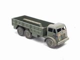 a toy truck that is sitting on a white surface