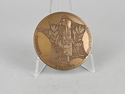 an image of a gold medal on a clear stand
