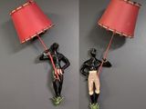 two pictures of a man holding a lamp on a wall